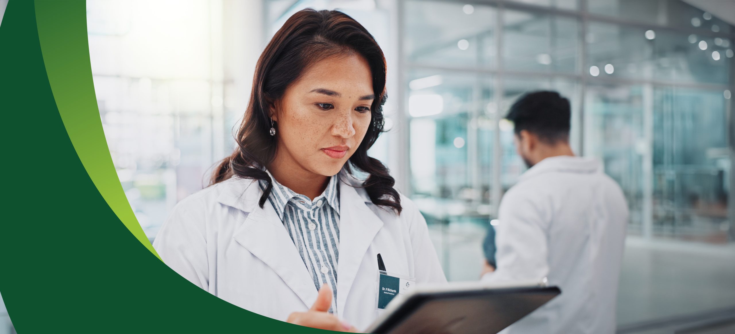 Hospital, doctor or woman with tablet, healthcare or internet with research for cure, online reading or medical news. Professional, employee or physician with tech, digital app for schedule or result.